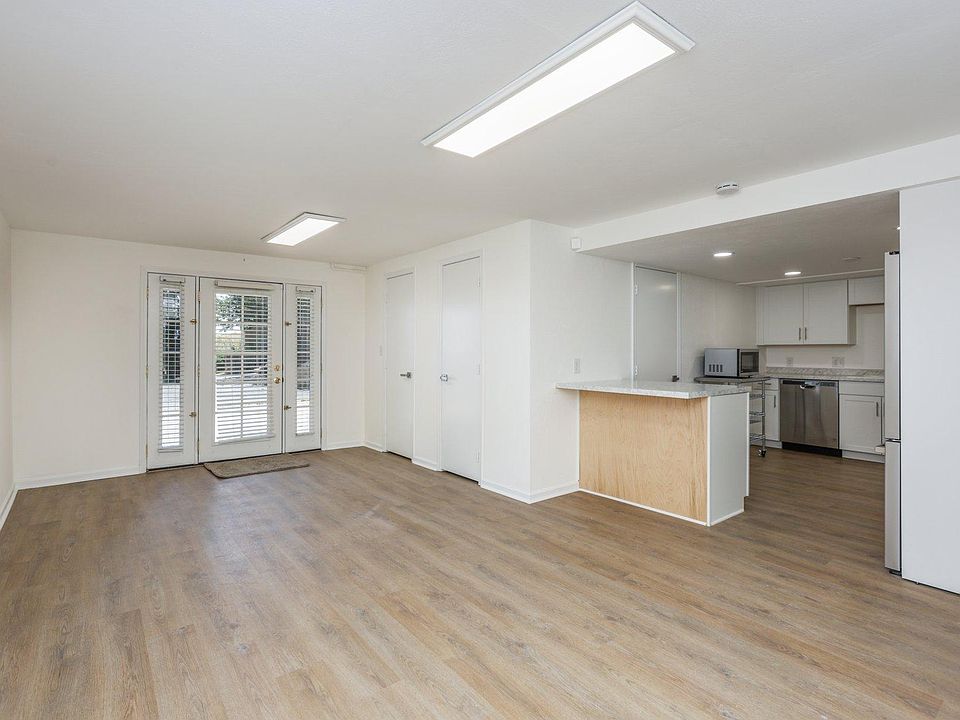 Great room/living dining area. Light & bright. Newly renovated with new flooring, paint, appliances & more.