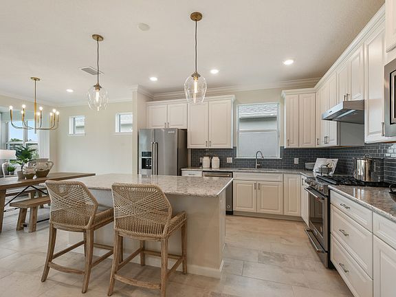 Kitchen opens up to cafe dining space