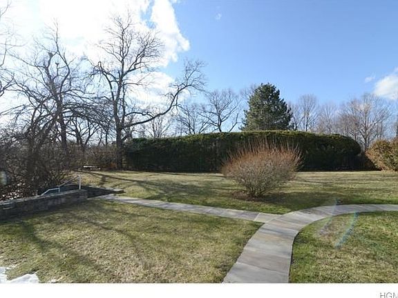 Front yard with flag stone steps to lower level.