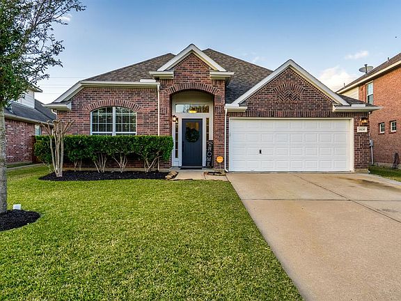Classic mostly brick elevation with recent roof replaced in 2017.