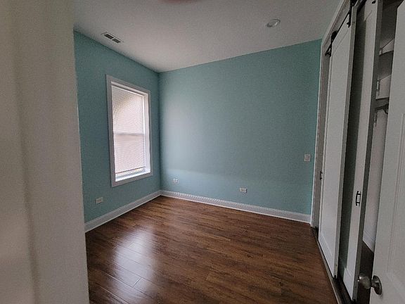 Large front bedroom with barn style doors in super large closet.