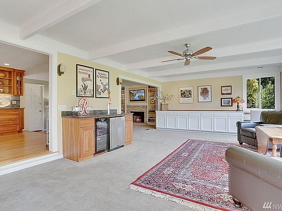 Family room with bar and cozy fireplace