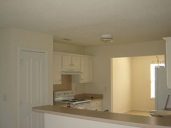 Open Kitchen, Dinning Room in front and Breakfast area