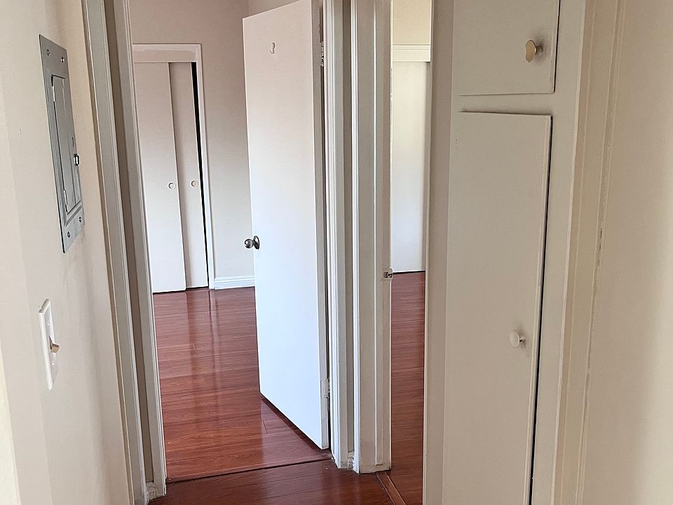 Hallway leading to bedrooms and main full bath.
