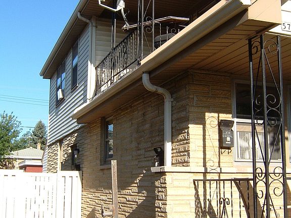 South side of house, fenced backyard, upstairs balcony