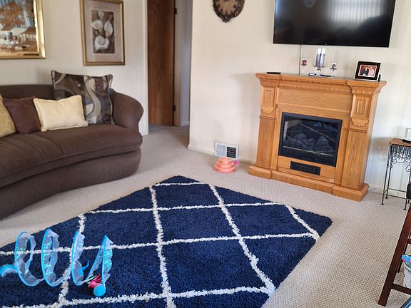 Living room area with a fire place.