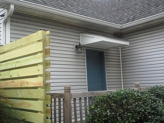 Privacy screened porch off bedroom