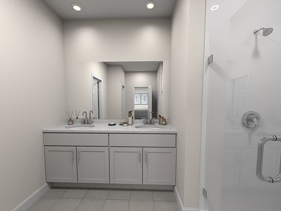 The primary bath offers a large walk-in shower and dual vanity.