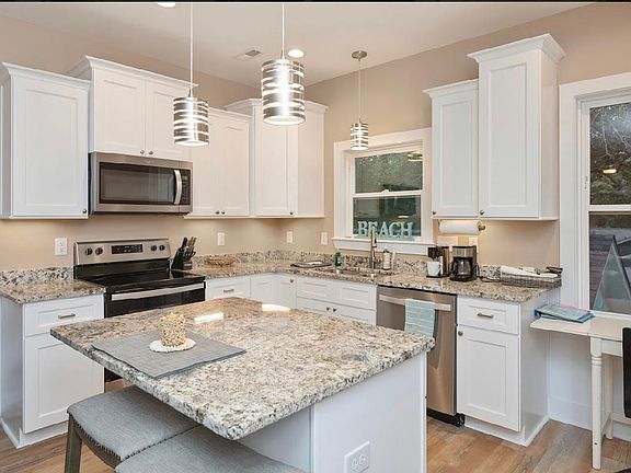 kitchen with granite countertops and new appliances