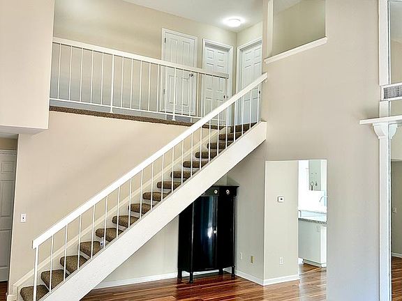 Living room with staircase to upstairs