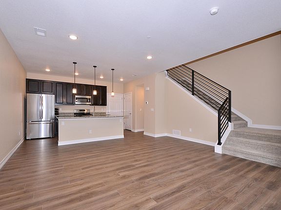 Kitchen with Stainless appliances, granite counters and with space for bar stools