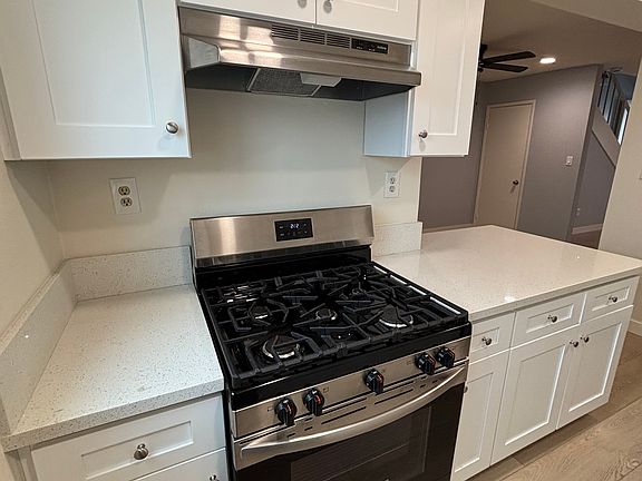 Modern appliances in kitchen with dishwasher and refrigerator
