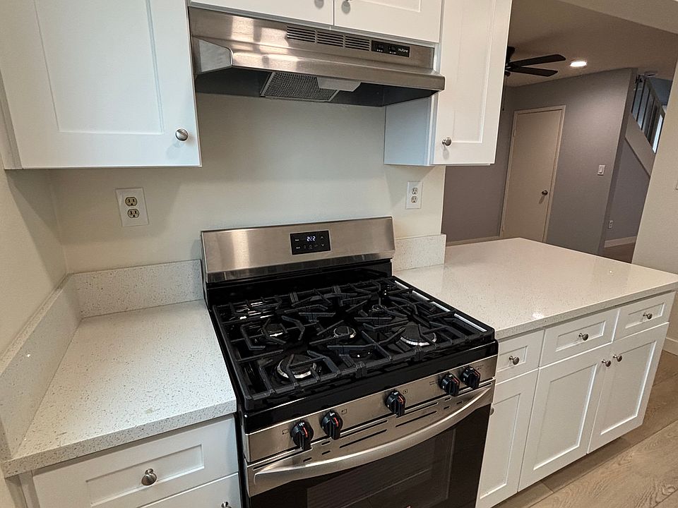 Modern appliances in kitchen with dishwasher and refrigerator
