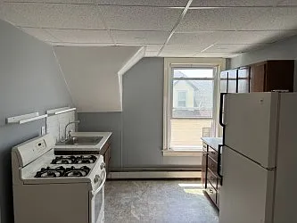 View of Kitchen, the stove is gas, fridge is over-sized, plenty of room! You can't see the pantry door, which adds much storage to this great kitchen!
