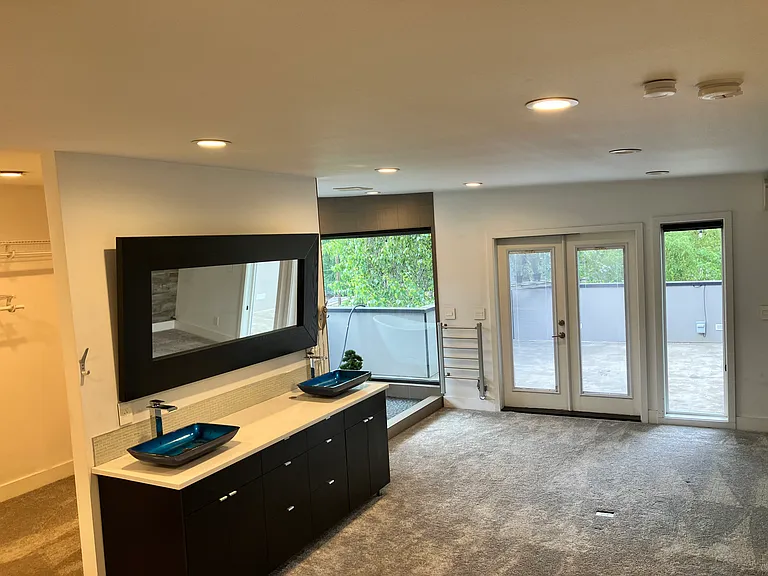 Master (primary) Suite looking Northwest towards Tub/Shower & Deck