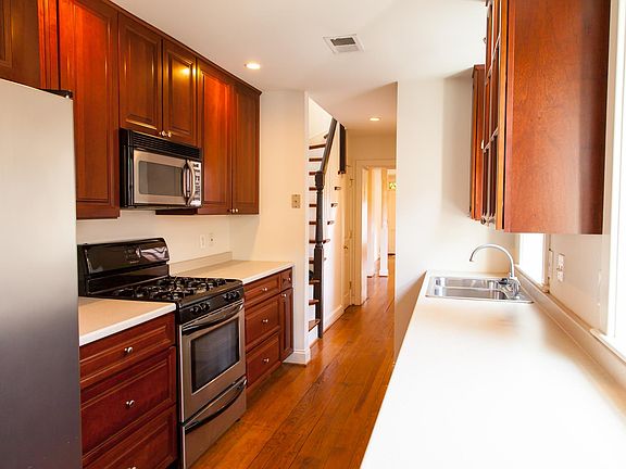 Galley kitchen with high end cabinetry