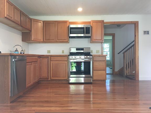 Kitchen with new stove, new dishwasher, new floors!