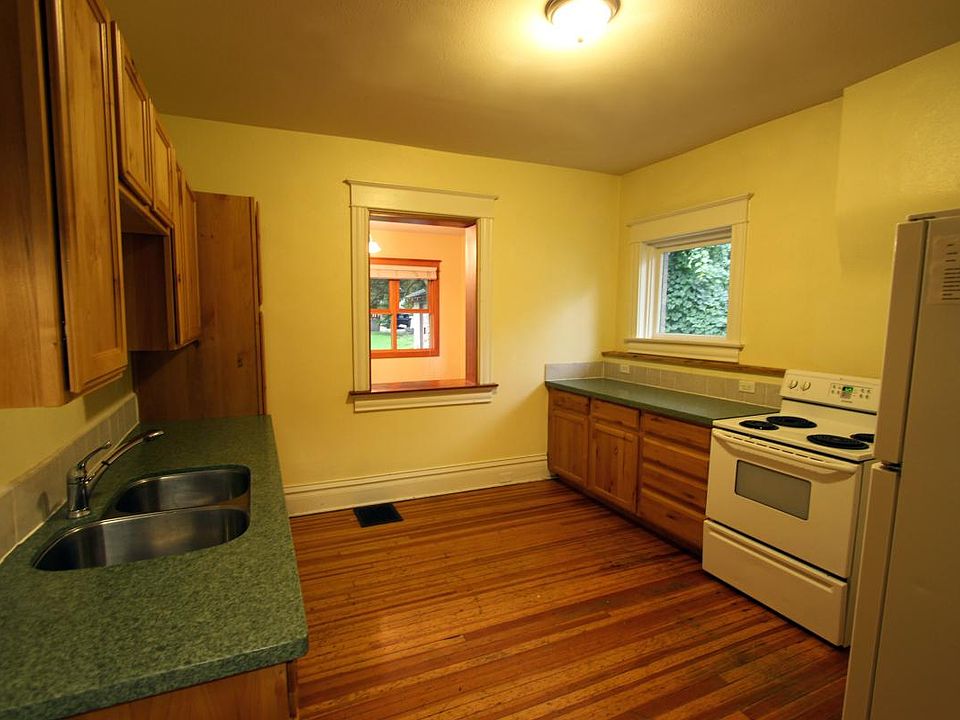 Kitchen with granite counters and dishwasher