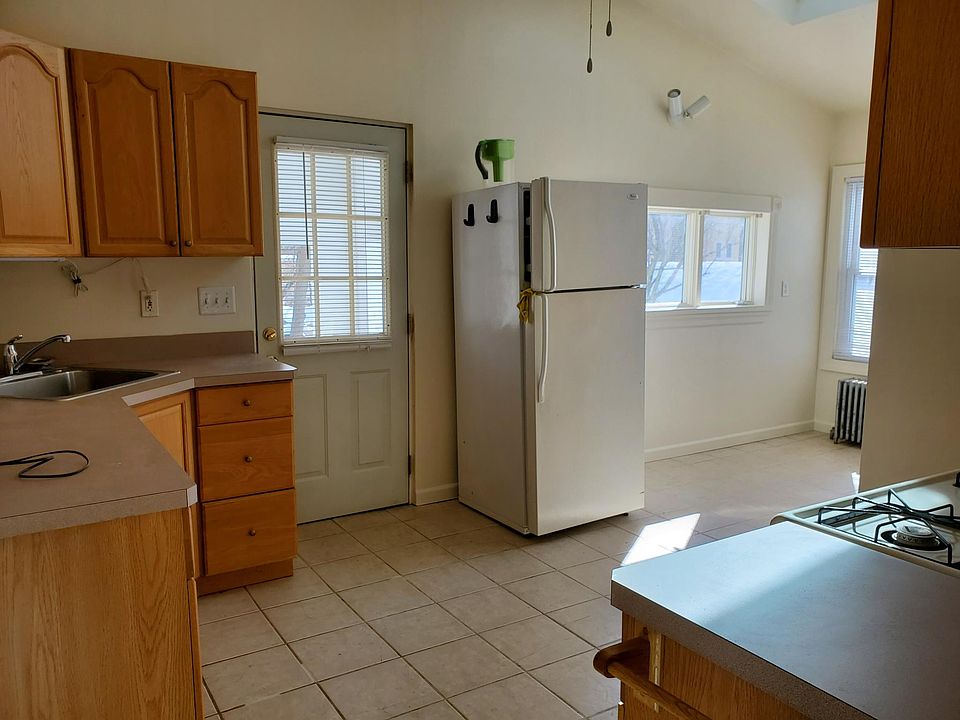 Kitchen with high ceiling and skylight