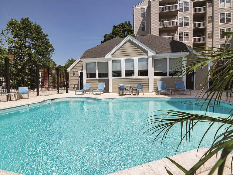 Sparkling Pool & Sundeck with Relaxing Lounge Chairs