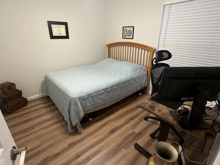 2nd Bedroom but shows queen sized bed.