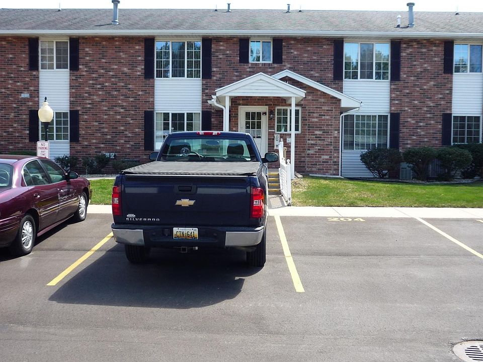 Another view of main entrance from parking lot in back of building