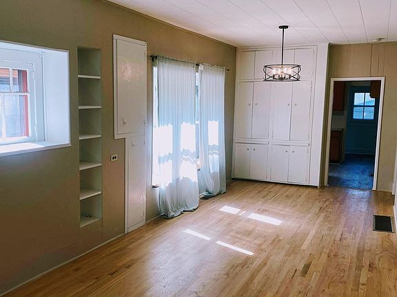 Dining area with cabinets for storage.