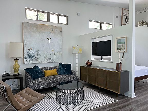 Enter into the modern living space filled with beautiful art and bright light