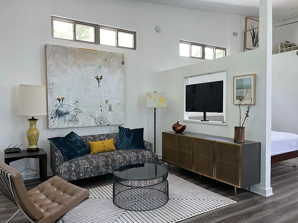 Enter into the modern living space filled with beautiful art and bright light