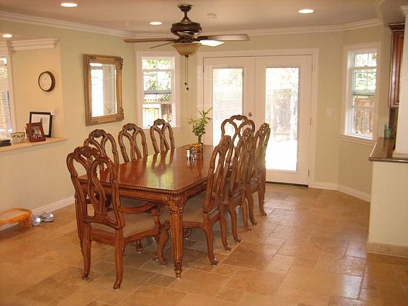 Open dining room with French Doors to backyard