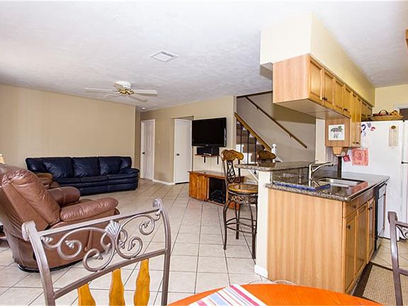 View from Breakfast into the Living Room, great tile floors and open floor plan