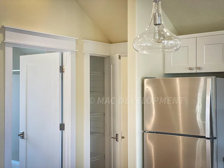 3 Glass Pendants provide extra ambience lighting in the kitchen