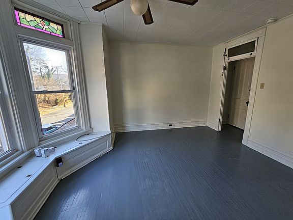 Spacious living room with big beautiful bay windows!