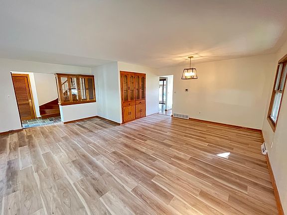 Front family room with dining area and built-in cabinets.