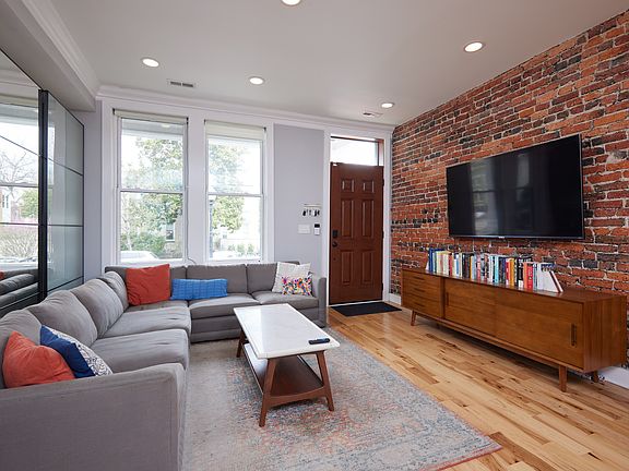 Family room with exposed brick and lots of light