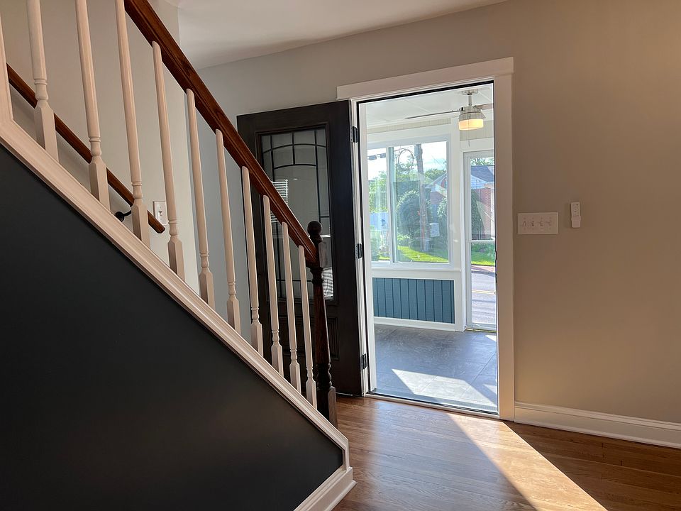 Front door opening to the porch