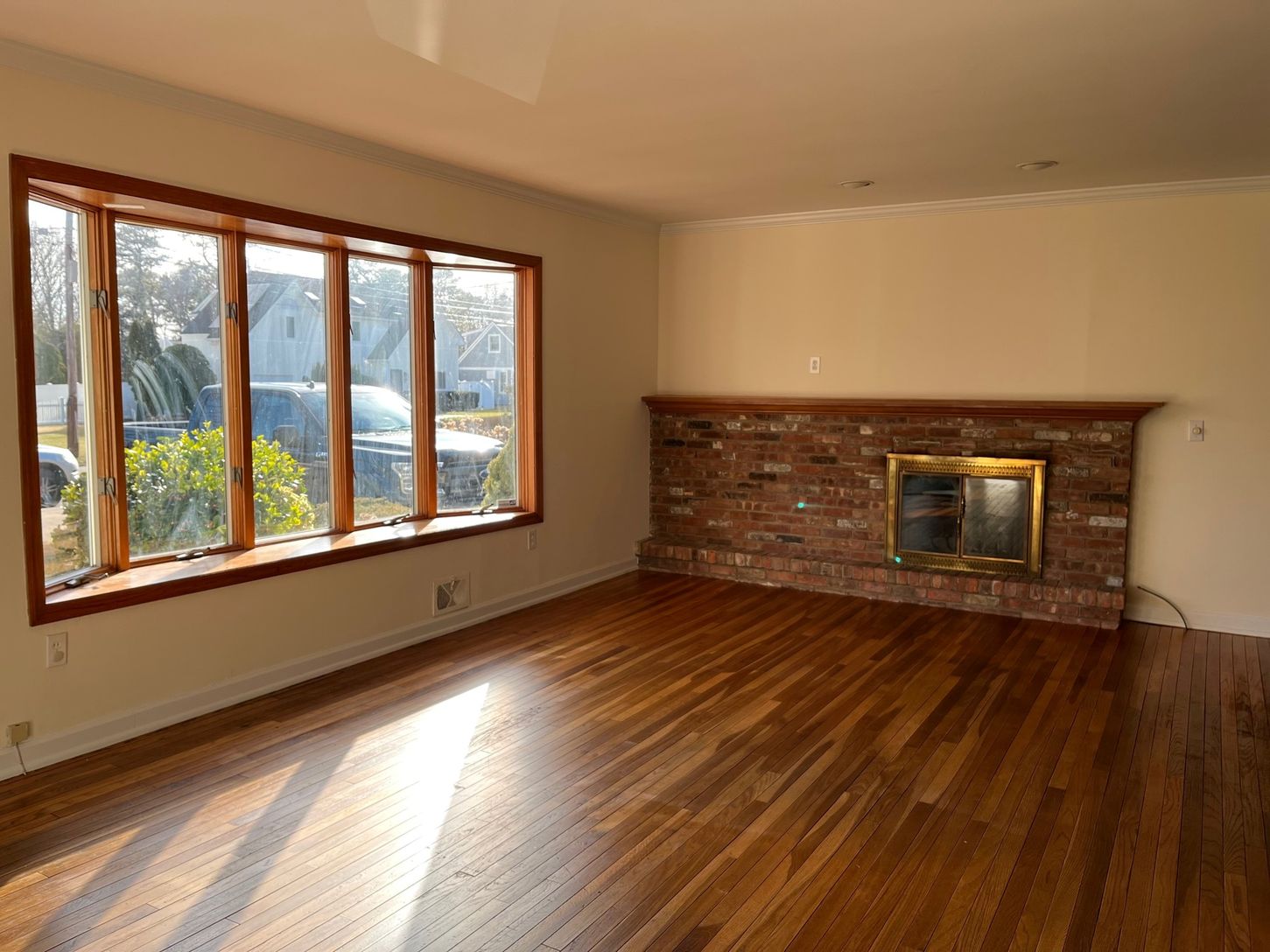  Open Living Room with Hardwood Floors and Fireplace