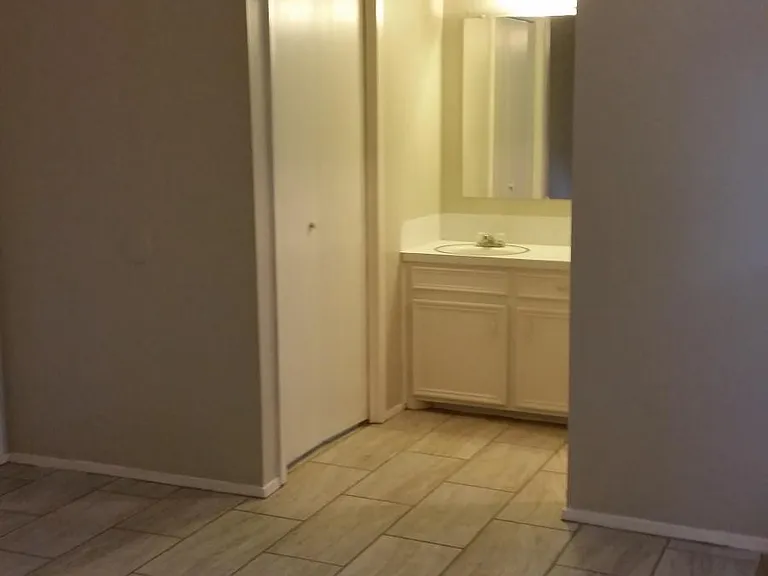 Master bathroom with new carpet and floor tile.