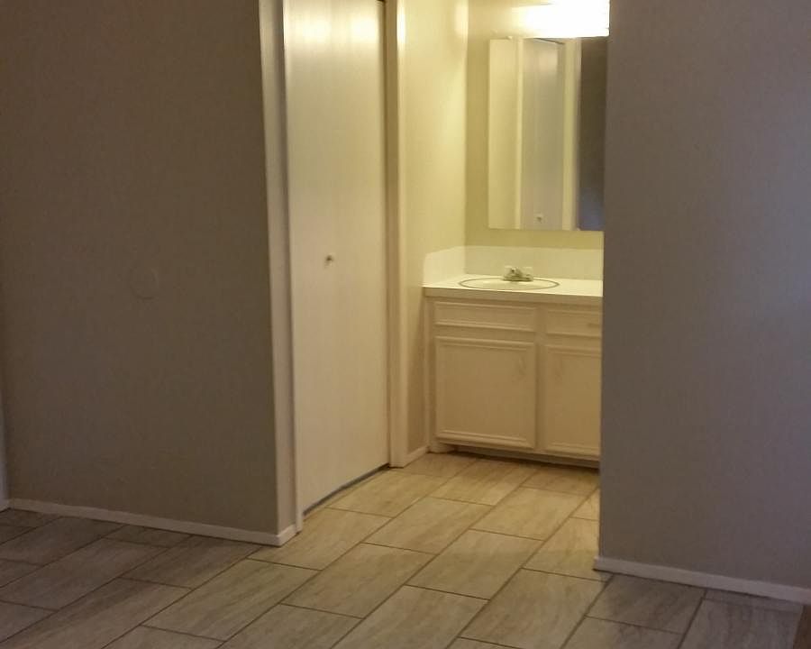 Master bathroom with new carpet and floor tile.