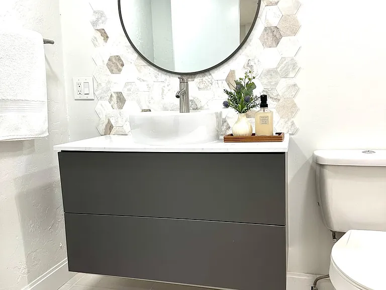 This bathroom is bright, featuring a modern design.