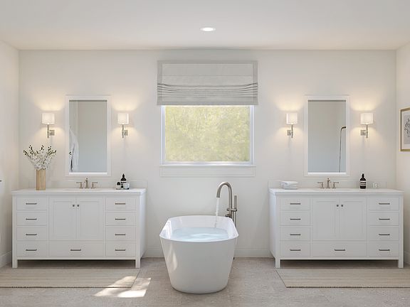 Primary bath with dual sinks and brushed nickel fixtures throughout
