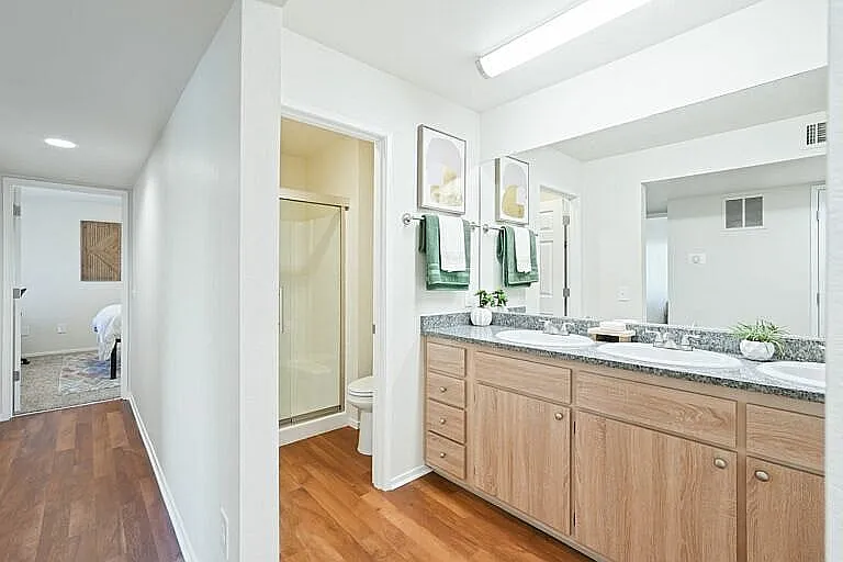 Explore elegance in comfort with this modern bathroom featuring sleek design elements.