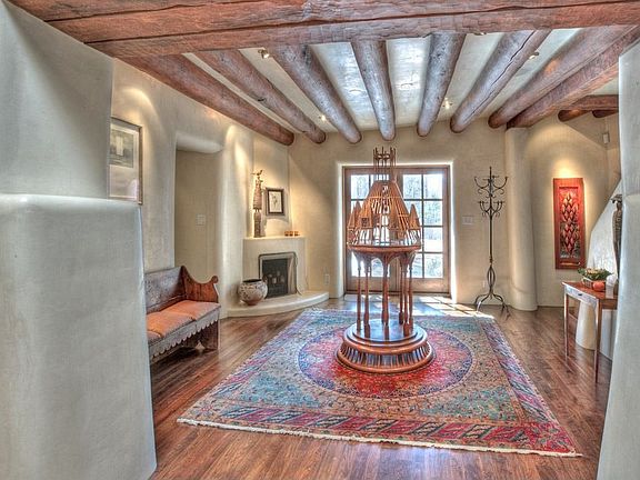 The Old World elegance of the grand foyer begins with 10-foot antique mesquite doors that have been 