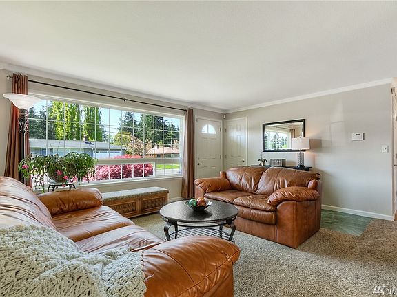 Step inside to the living room and instantly feel the warm atmosphere of this home, with upgraded interior paint, crown molding and flooring throughout!