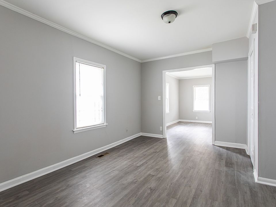 An adjoining dining or bonus room connects the front living space and kitchen, providing the perfect opportunity for a dining room, home office, or cozy den.