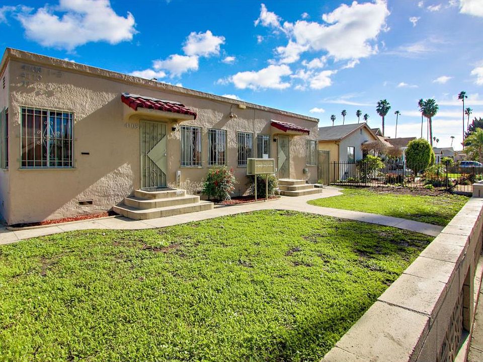 Front of building on palm tree filled street