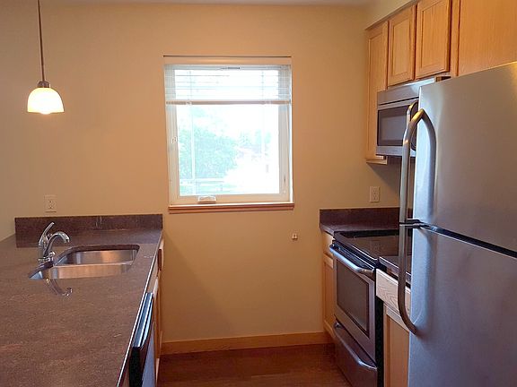 Granite countertops and stainless steel appliances.