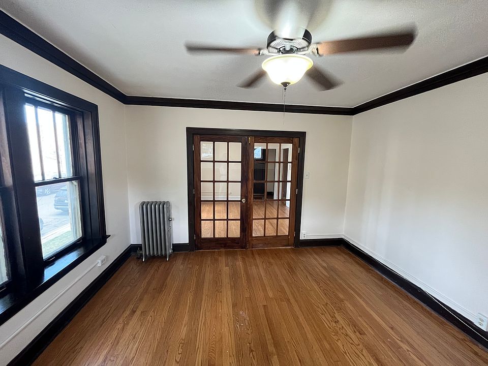 Formal Living Room could be Bedroom #2. View from Fireplace towards French Doors to Dining room OR your new Family Room