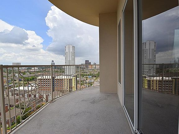 Spacious outdoor terrace wraps around along the west side of the building and on the north side.