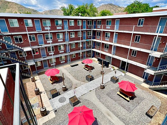 Experience the perfect outdoor retreat in this lively apartment courtyard.